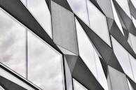 Creative facade design featuring layered materials and dynamic shapes.