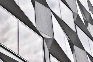 Creative facade design featuring layered materials and dynamic shapes.