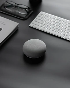 Minimalist workspace featuring elegant branding materials and a luxury speaker preparing notes.