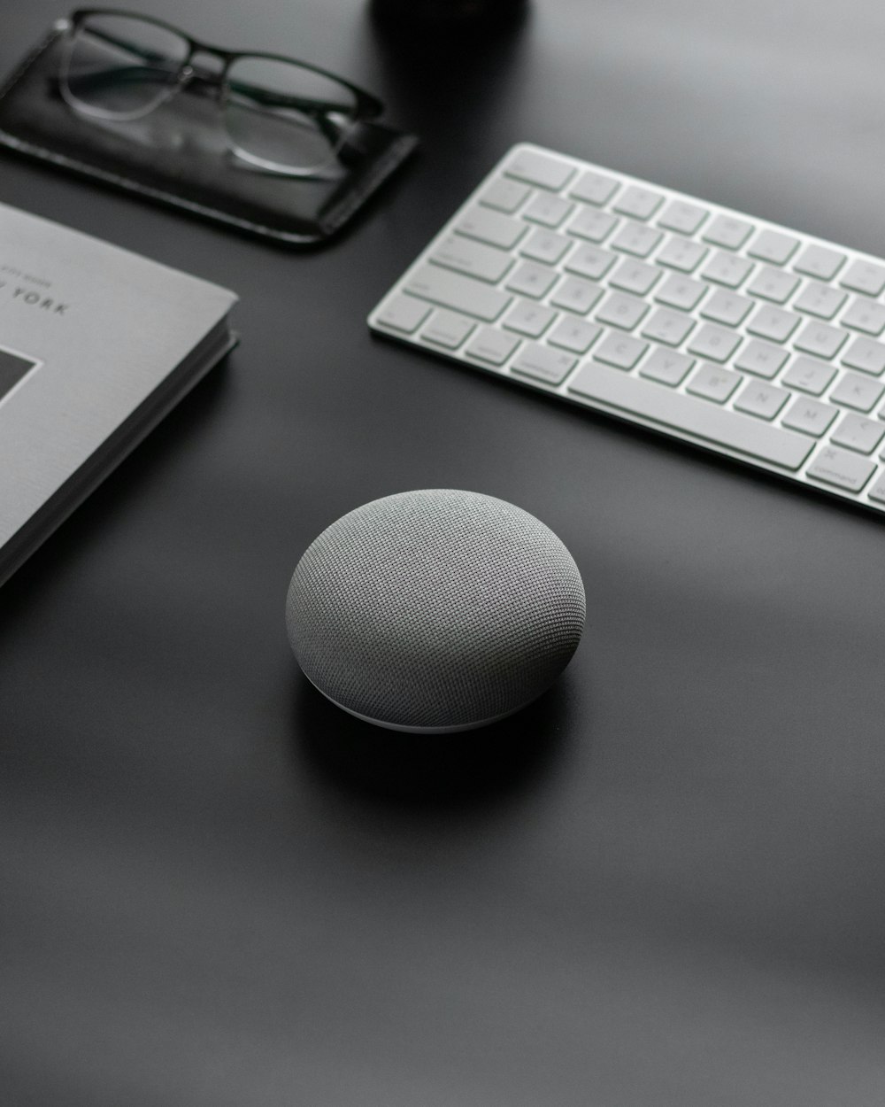 round gray Google Home Mini speaker