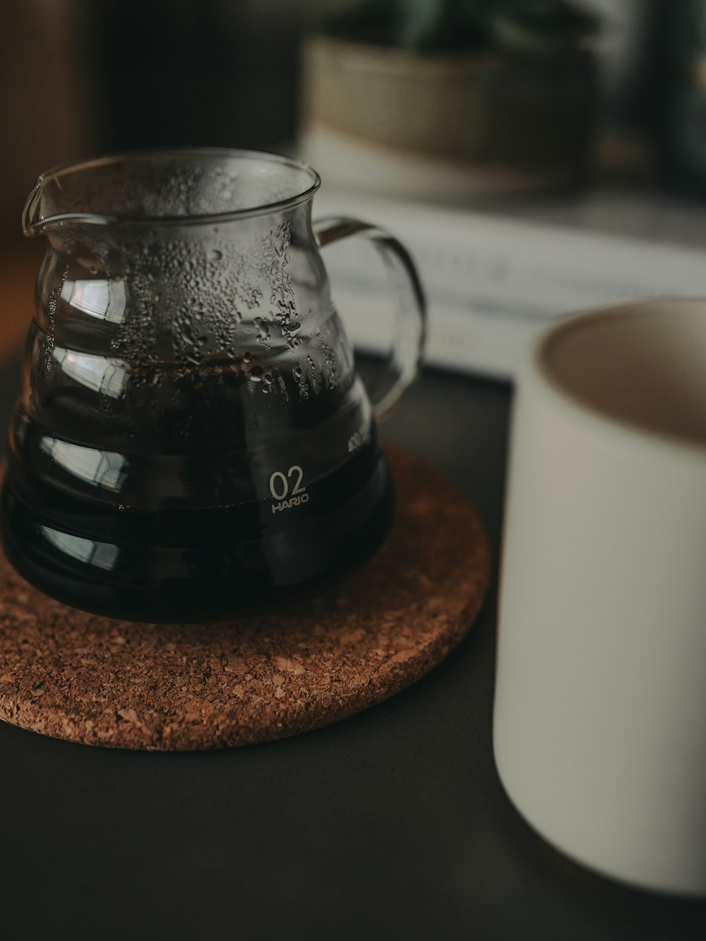 clear glass pitcher and white ceramic mug