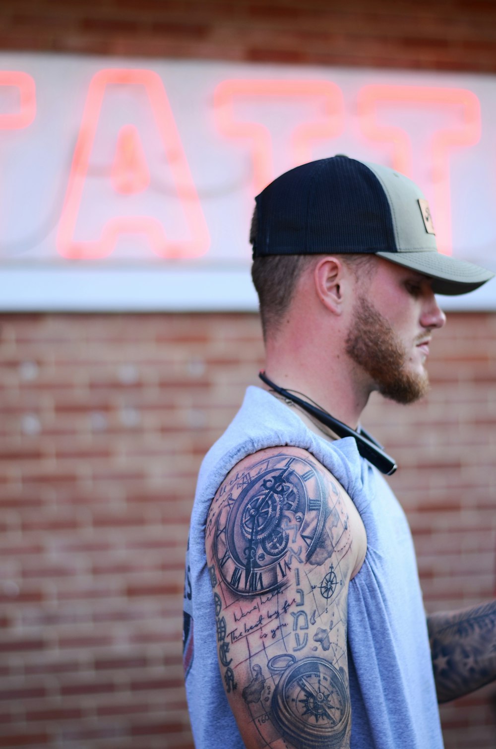 a man with a tattoo on his arm