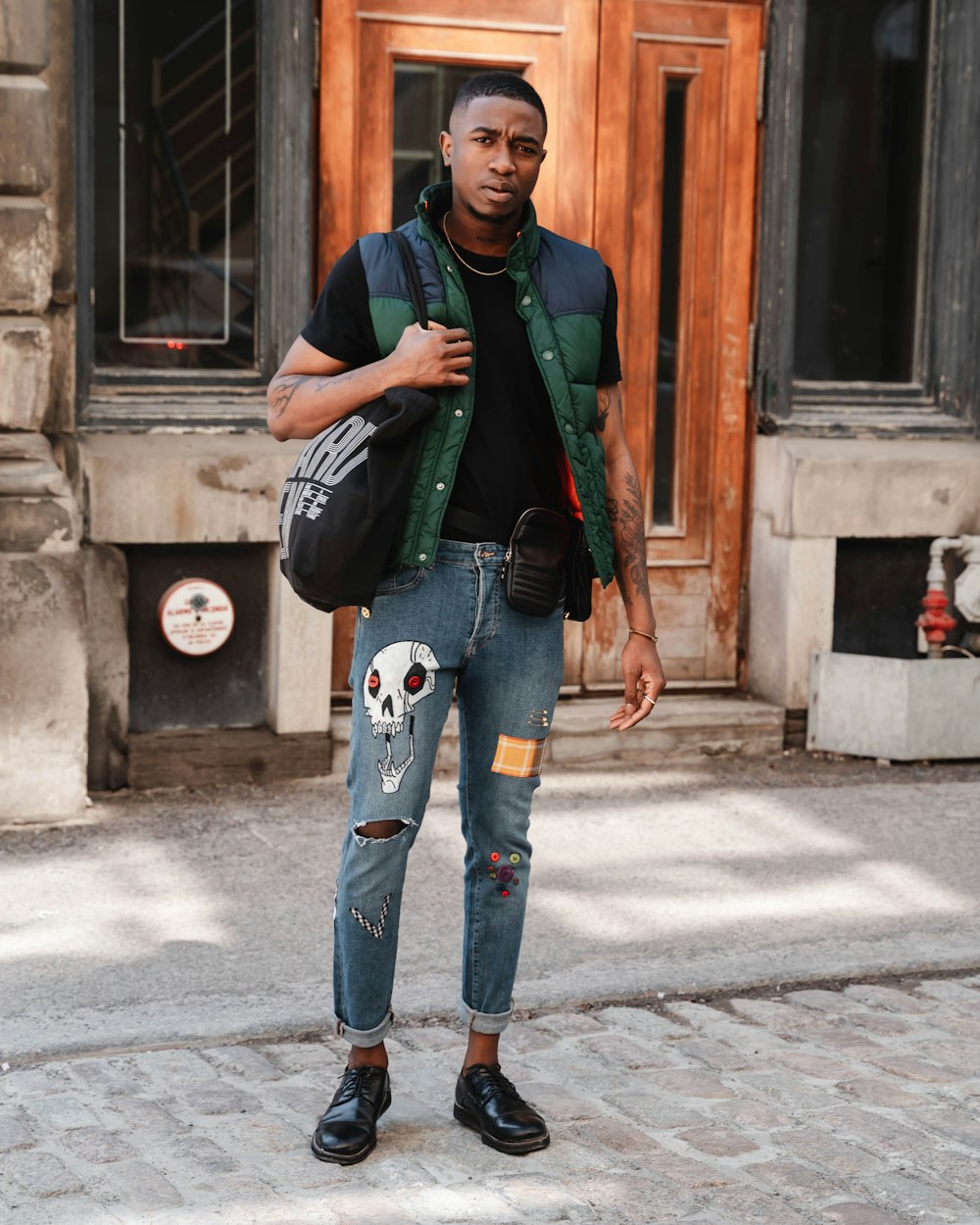 men's green and blue button-up bubble vest