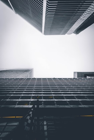 two buildings under white sky during daytime