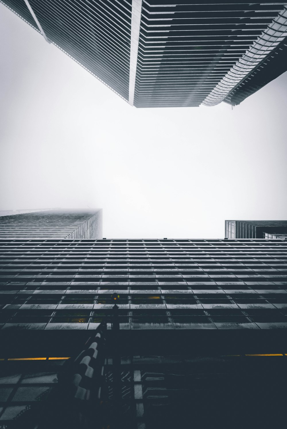 two buildings under white sky during daytime