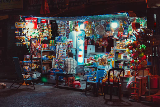 A compact micromarket setup with neatly arranged fresh snacks and beverages in a bright space.