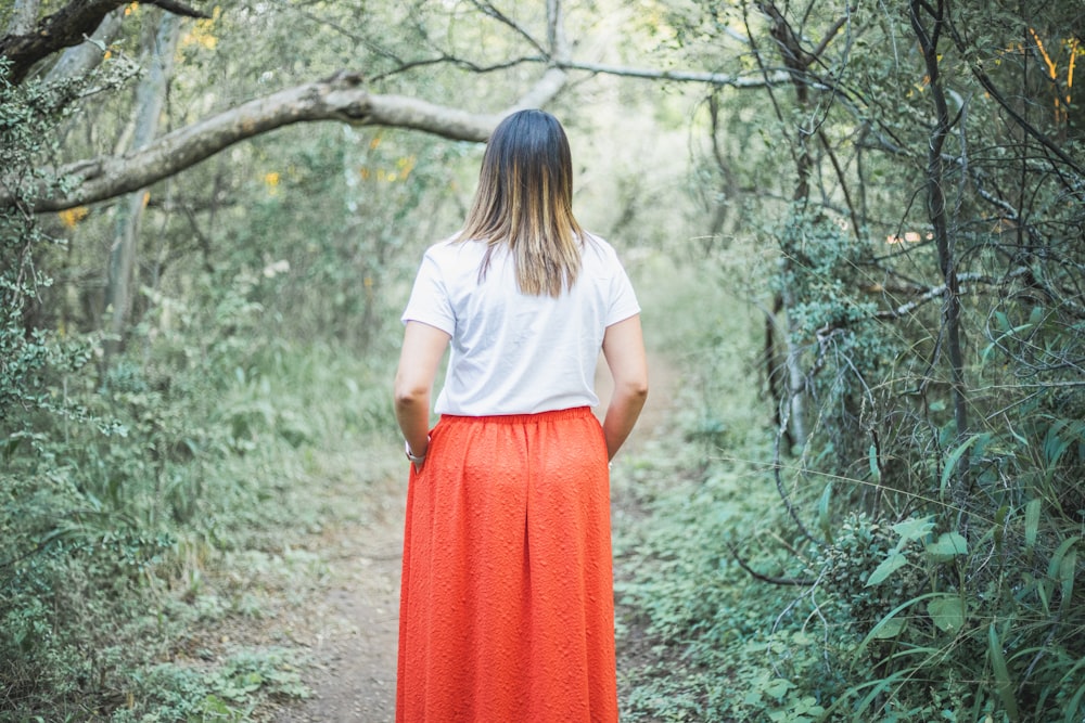 women standing in a forest during daytime