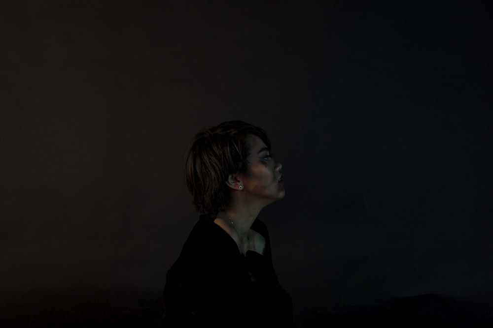 woman standing near black surface