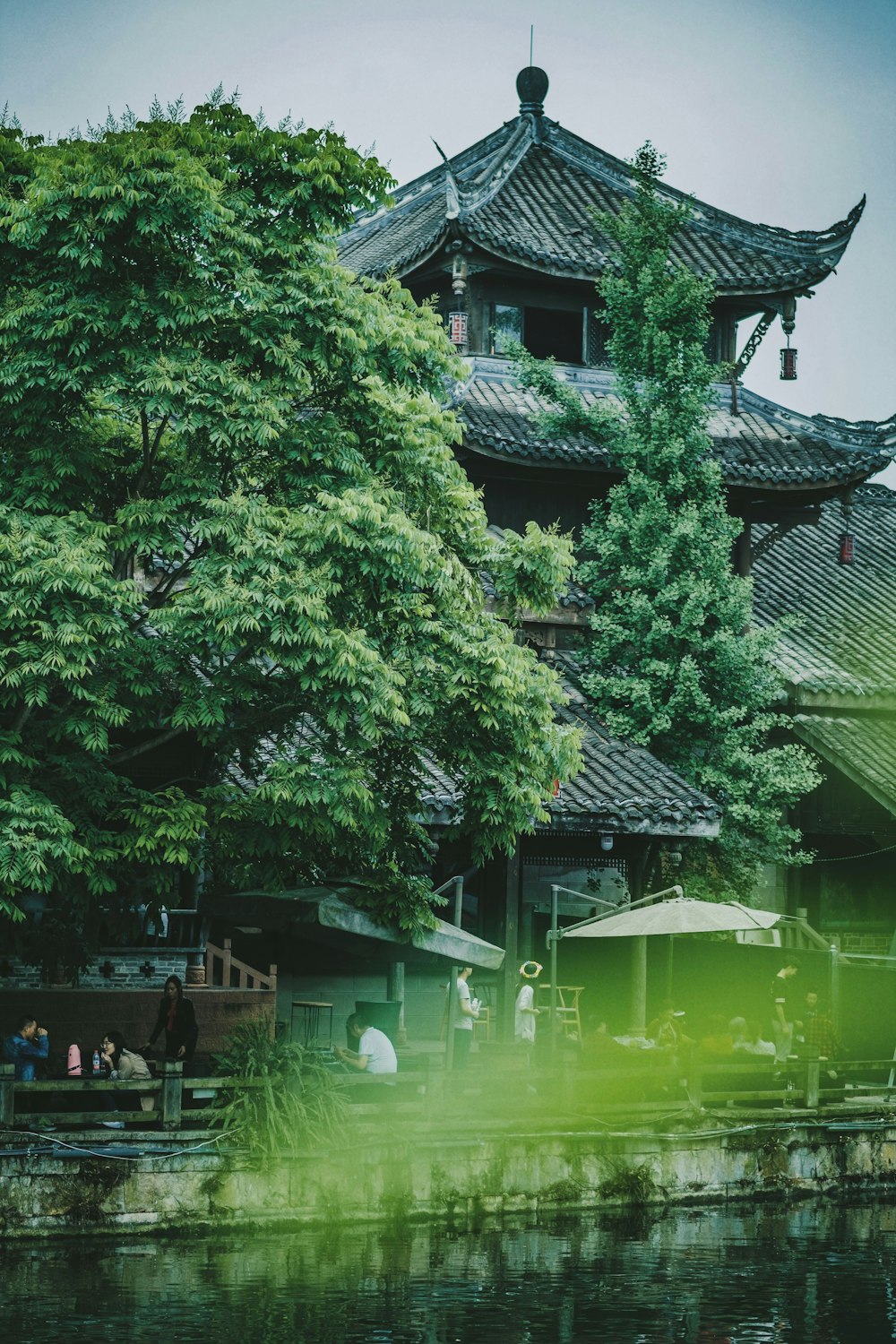 body of water near pagoda and trees
