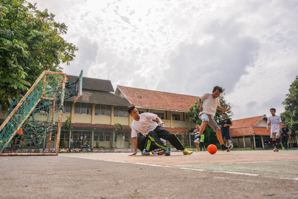 men playing soccer during daytime