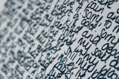 Close-up of a script with handwritten notes, resting on a dark indigo surface.