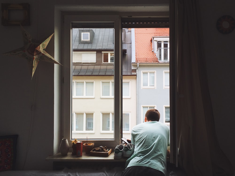 man near window