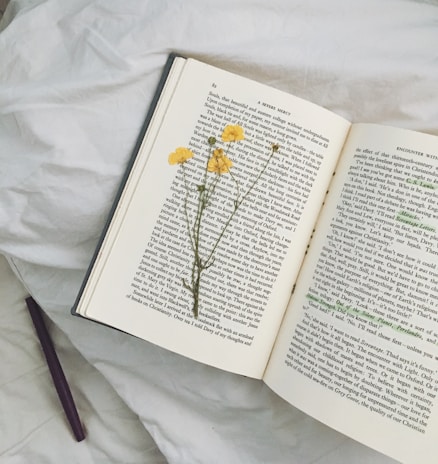 yellow flowers on open book
