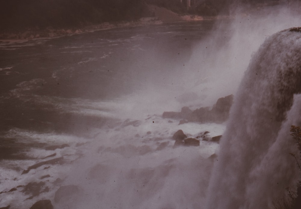 a large waterfall with water coming out of it