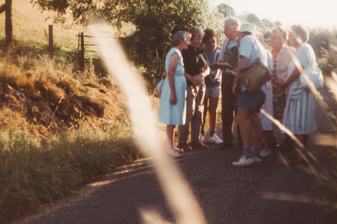 group of people standing on road during daytime