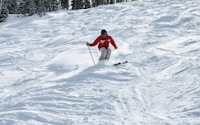 person skiing in a snow during daytime