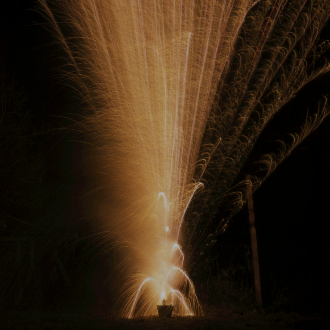 brown firework during night time