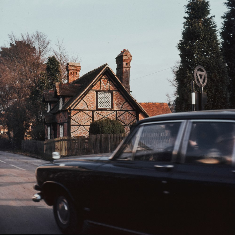 black car in a road during daytime