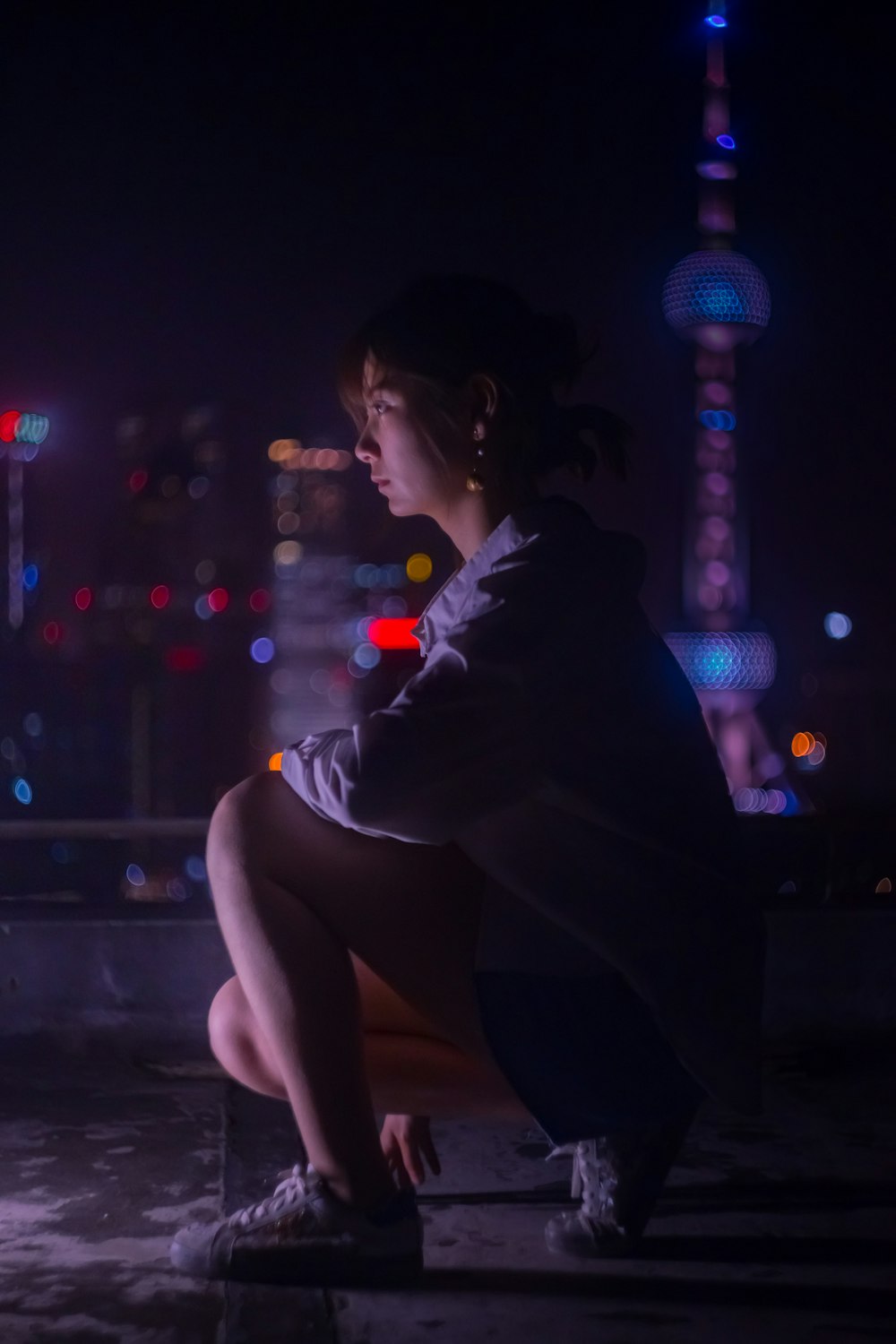 women sitting in a floor during nighttime