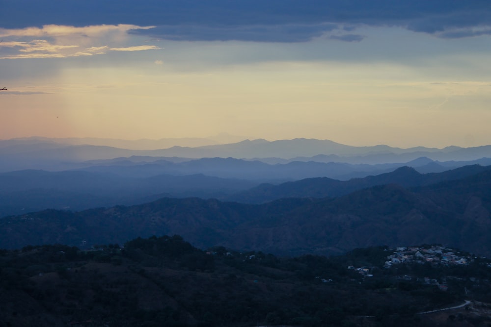 a view of a mountain range at sunset