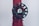 A close-up of a dark green valve wheel, mounted on a red pipe. The wheel has a central label with the word 'HYDRO'. The pipe has a textured surface with multiple facets and appears to be part of a larger industrial system.