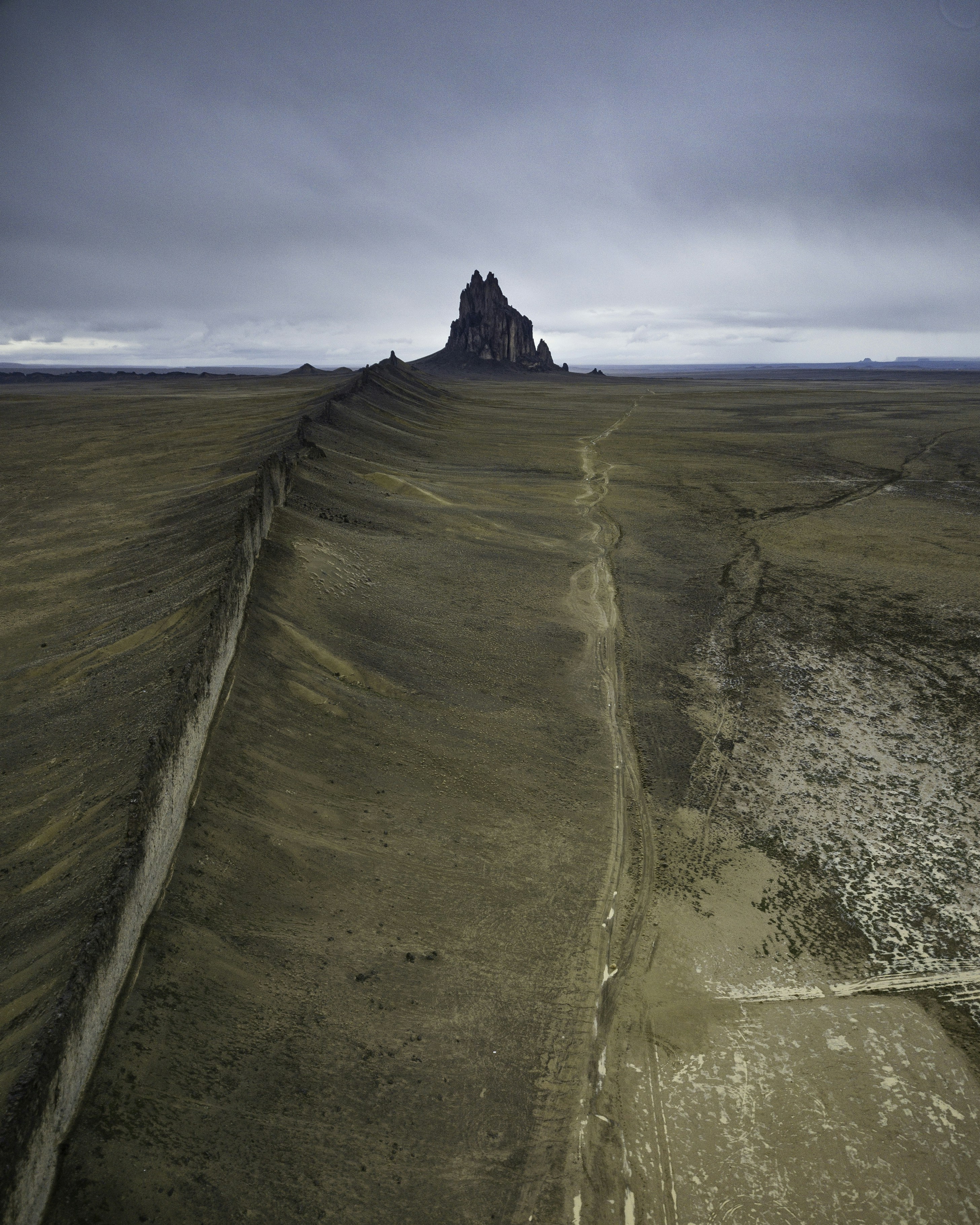 woman wearing yellow long-sleeved dress under white clouds and blue sky during daytime