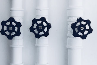 three black metal knobs