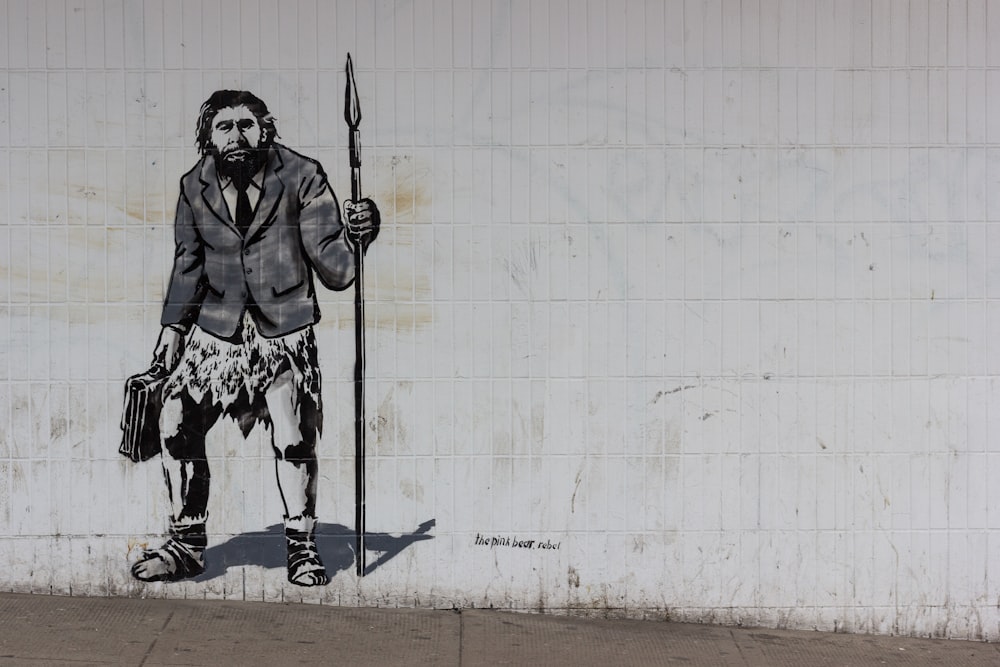 homme tenant une lance peinture murale