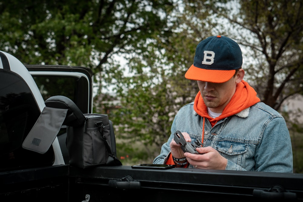 men's black and orange cap