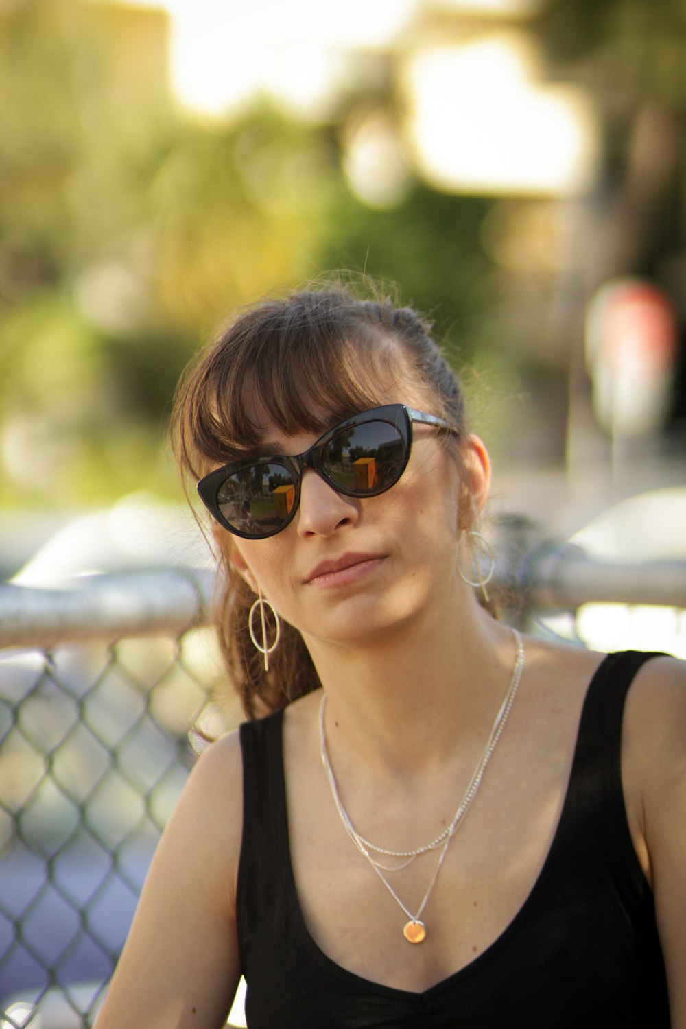 woman wearing silver-colored necklace