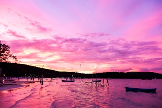 A scenic beach at sunset with vibrant colors reflecting on the water, perfect for a peaceful getaway.