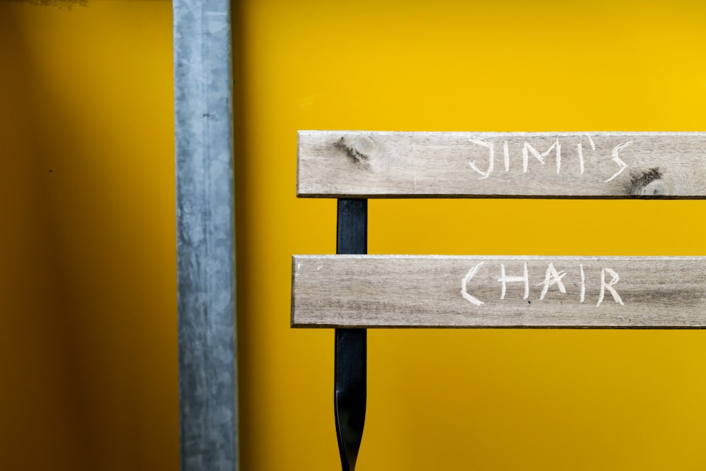 a pair of wooden signs that say jimmy and chair