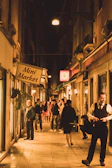 Local business owners exchanging goods and chatting warmly, creating a sense of neighborhood trust