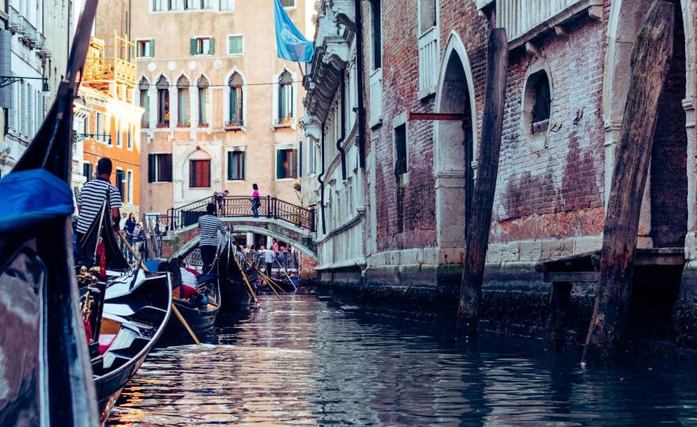 boats in body of water near buildings