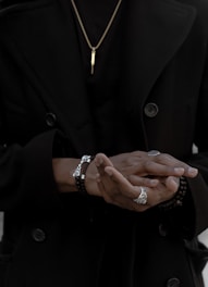 person wearing coat and jewelries