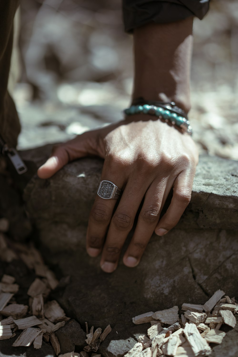 person wearing ring and bracelet