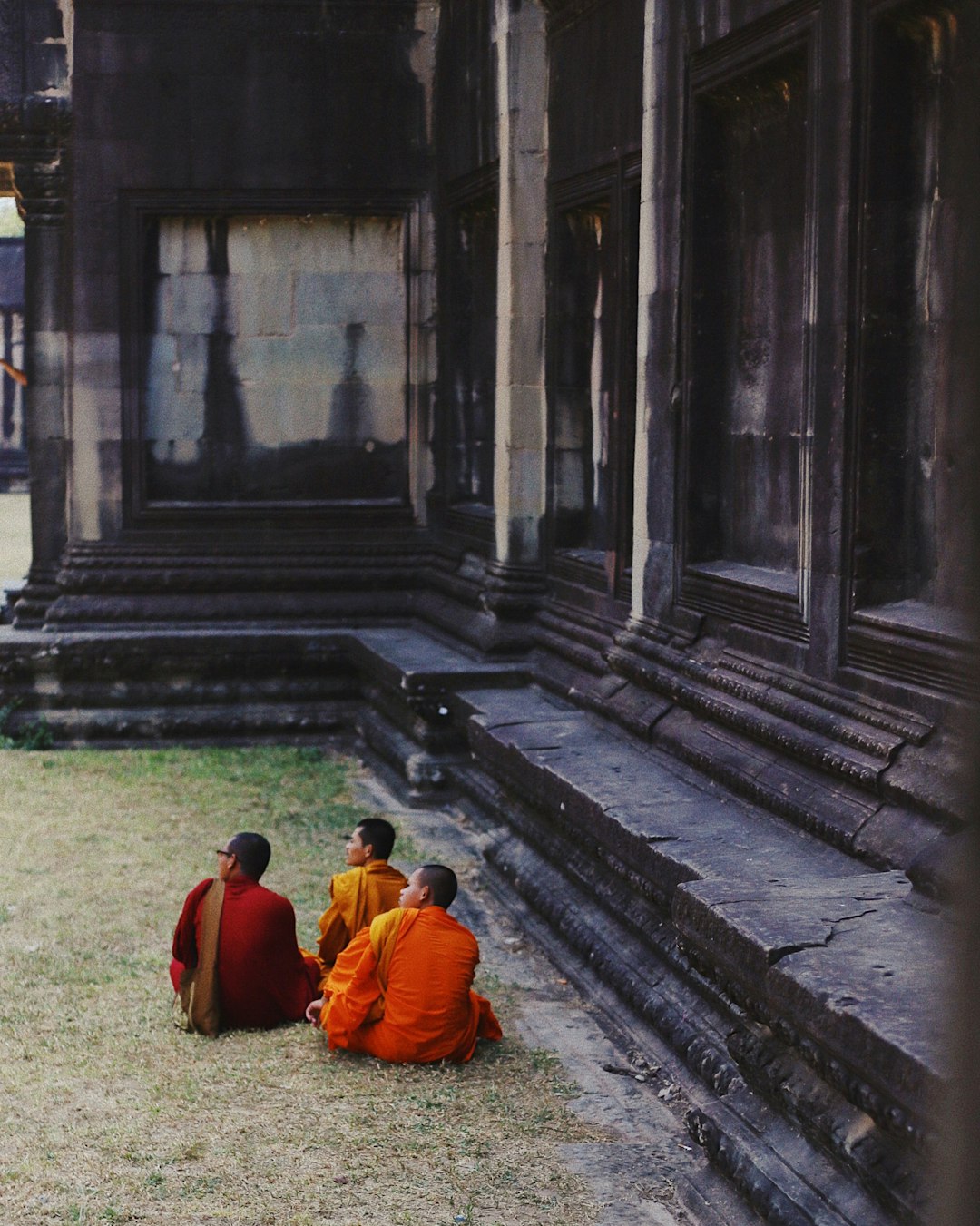 three monk sitting down