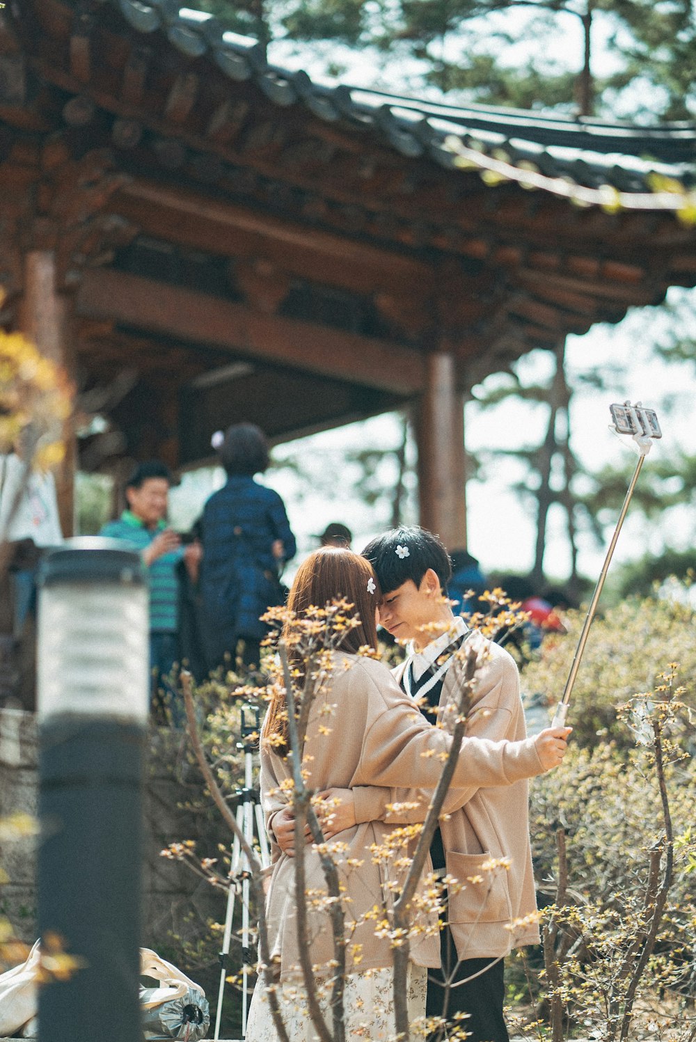 shallow focus photo of man and woman hugging