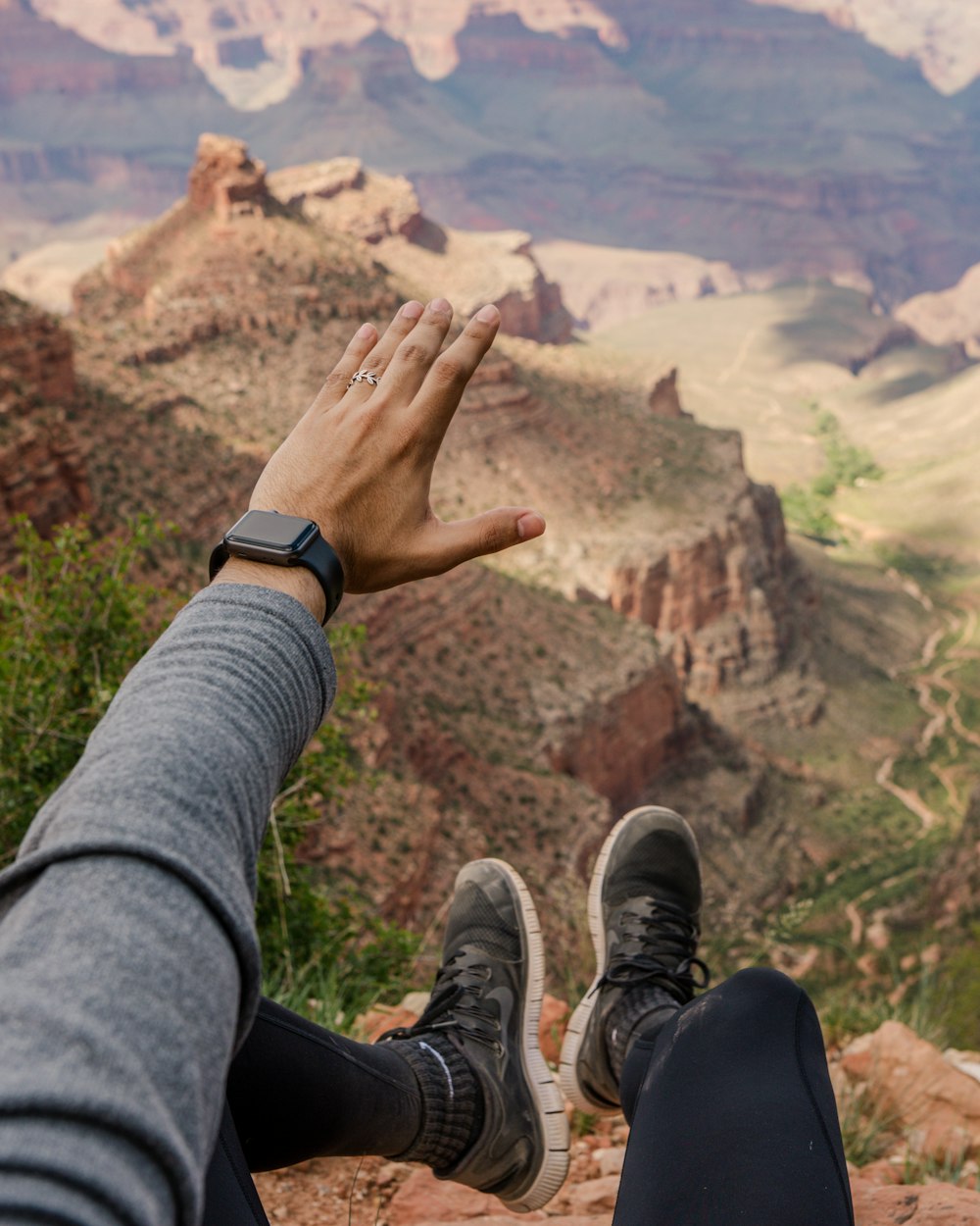 man sitting on cliff