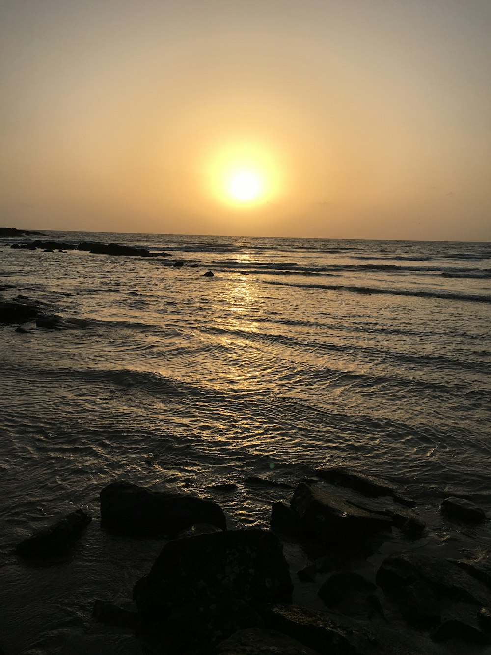 body of water under golden hour