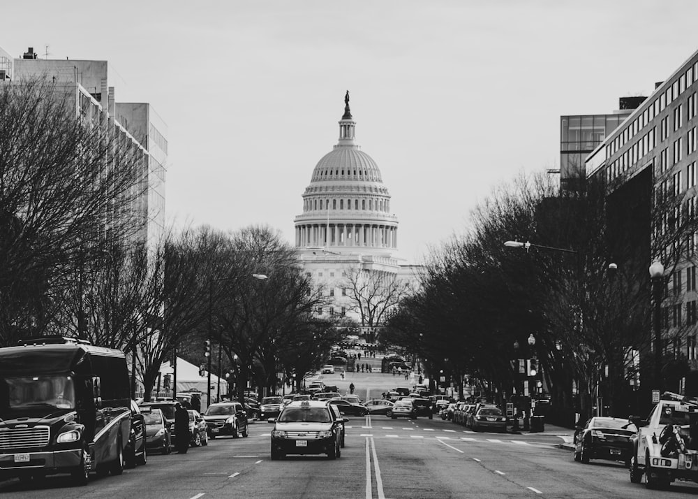 cars and bus parked at roadside near Capitol Hill