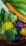 A colorful assortment of fresh vegetables and fruits including a carrot, lemons, broccoli, leafy greens, cucumber, red radishes, and purple cabbage. They are closely packed together, reflecting various shades and textures under a light source, with some water droplets visible on their surfaces.