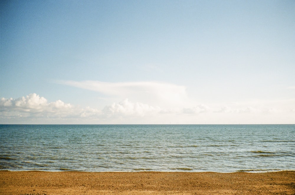 white and blue cloudy sky over the sea