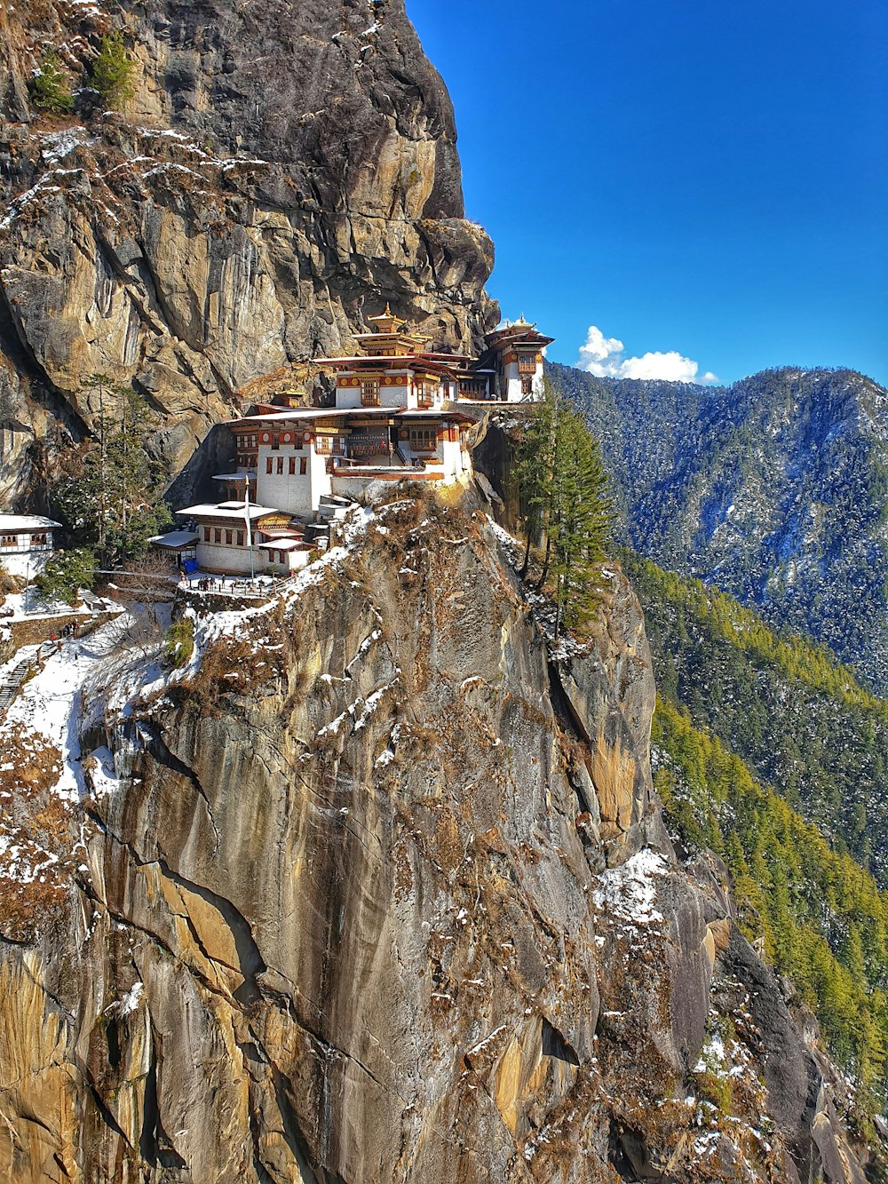 white and brown concrete houses on mountain