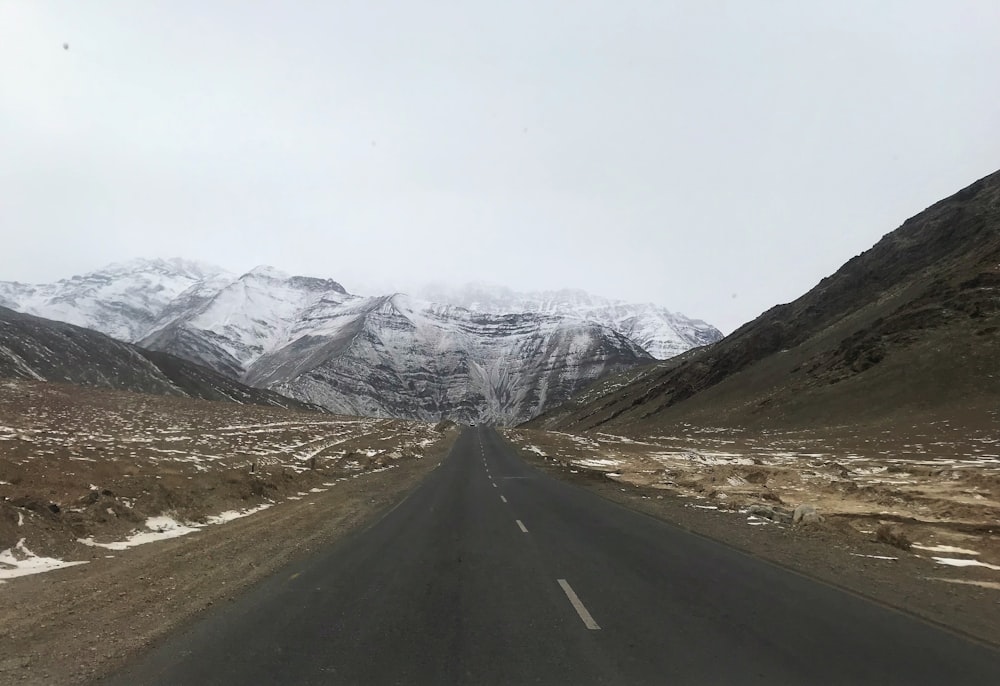 wide road surround by mountains