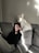 white dog beside woman sitting on couch