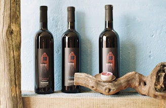 three black labeled bottles