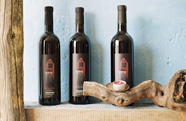 three black labeled bottles