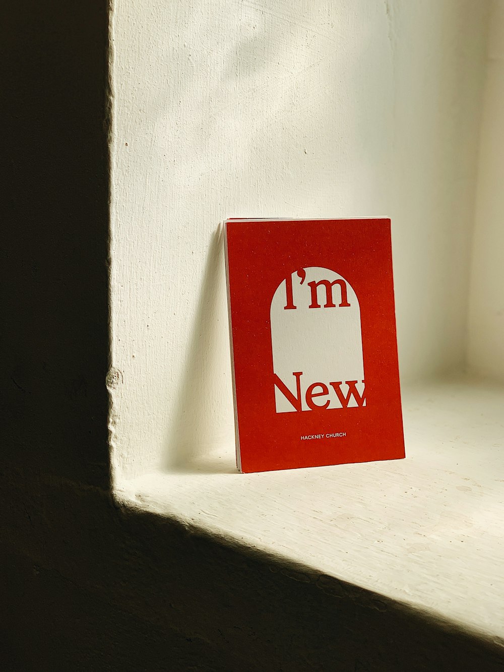 white and red labeled book close-up photography