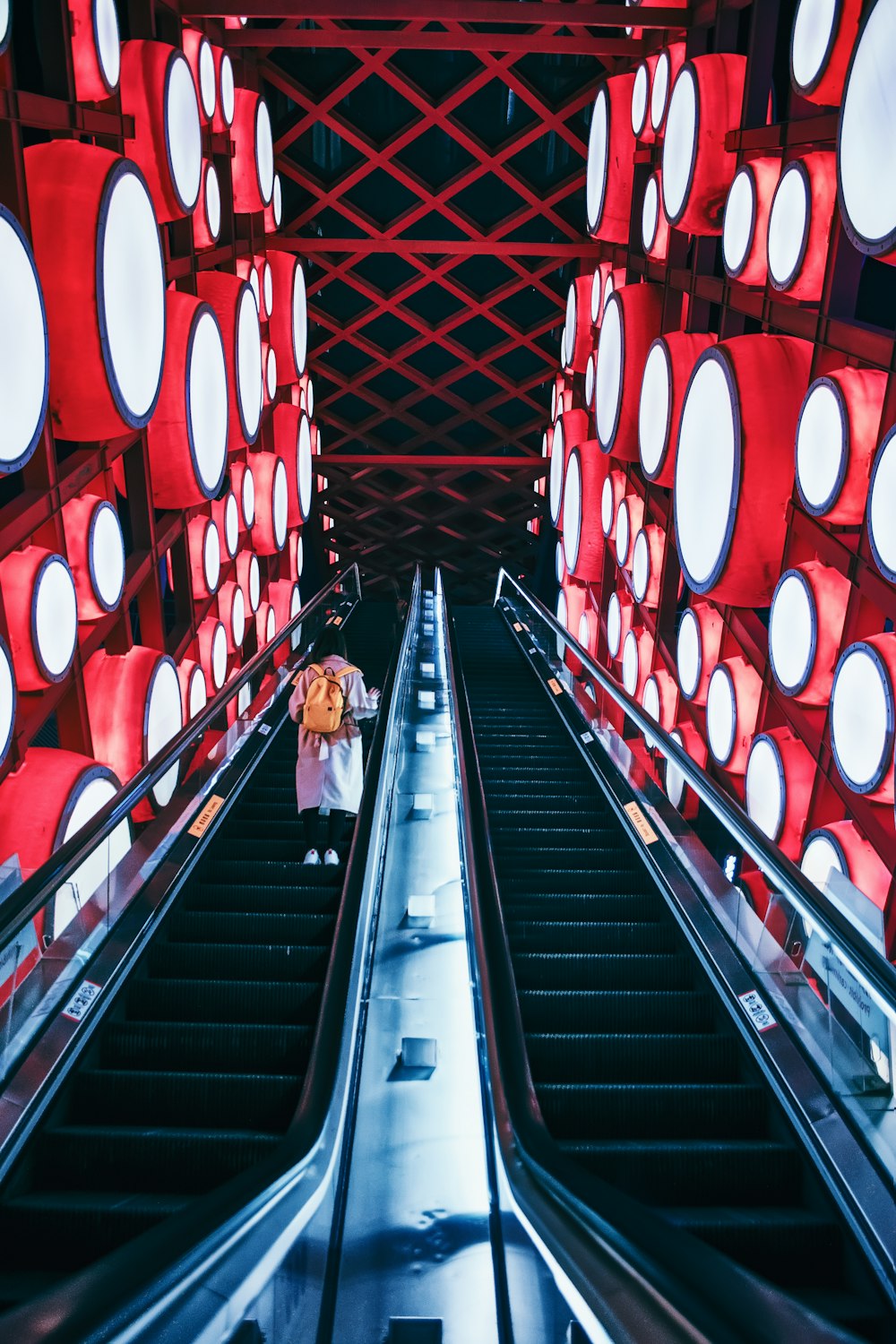 person riding escalator